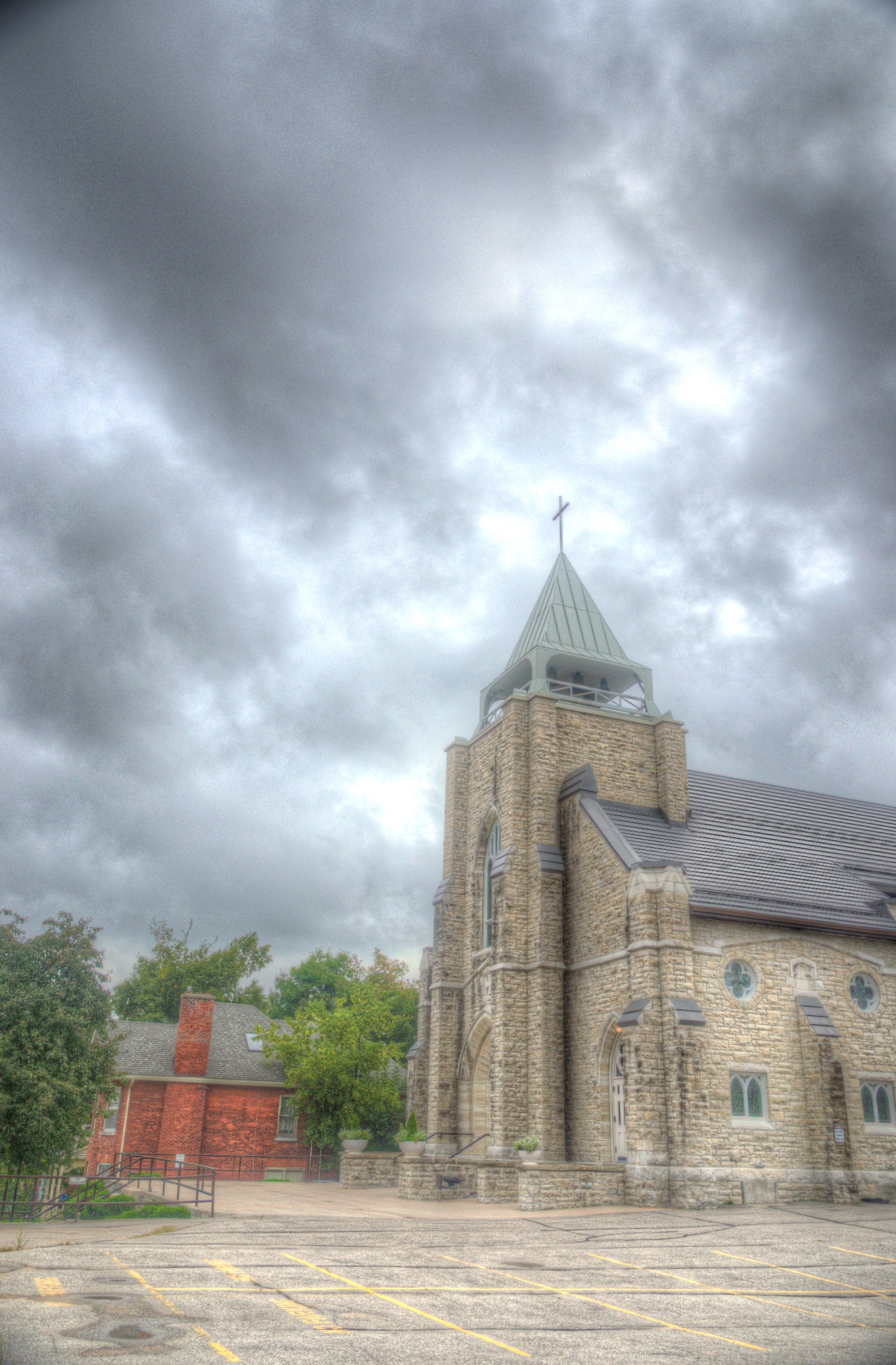 Outside image of St. Margaret's from the front view and beautiful clouds.